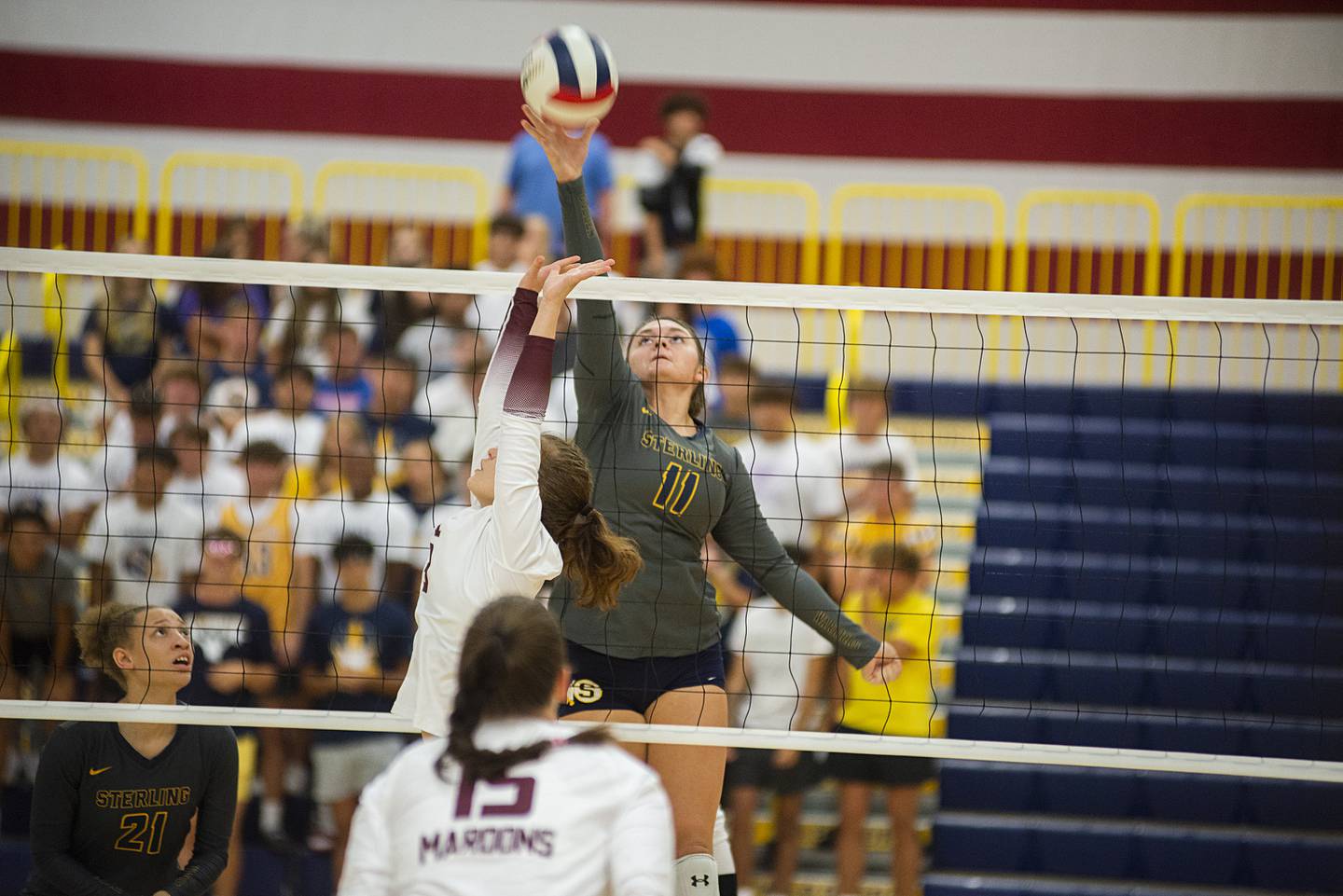 Sterling’s Kathryn Rowzee works the net Thursday, Sept. 1, 2022 against Moline.