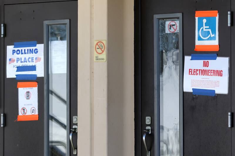 Political signs are seen near Bay Road at the Nunda Township offices and poling location on Tuesday, Feb. 9, 2021 in Nunda Township.