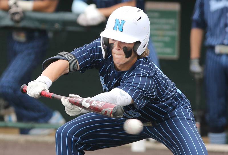 Nazareth's Cole Reifsteck tries to get a bunt down during their 16-3 win over Crystal Lake South Friday, June 10, 2022, in the IHSA Class 3A state semifinal game at Duly Health and Care Field in Joliet.