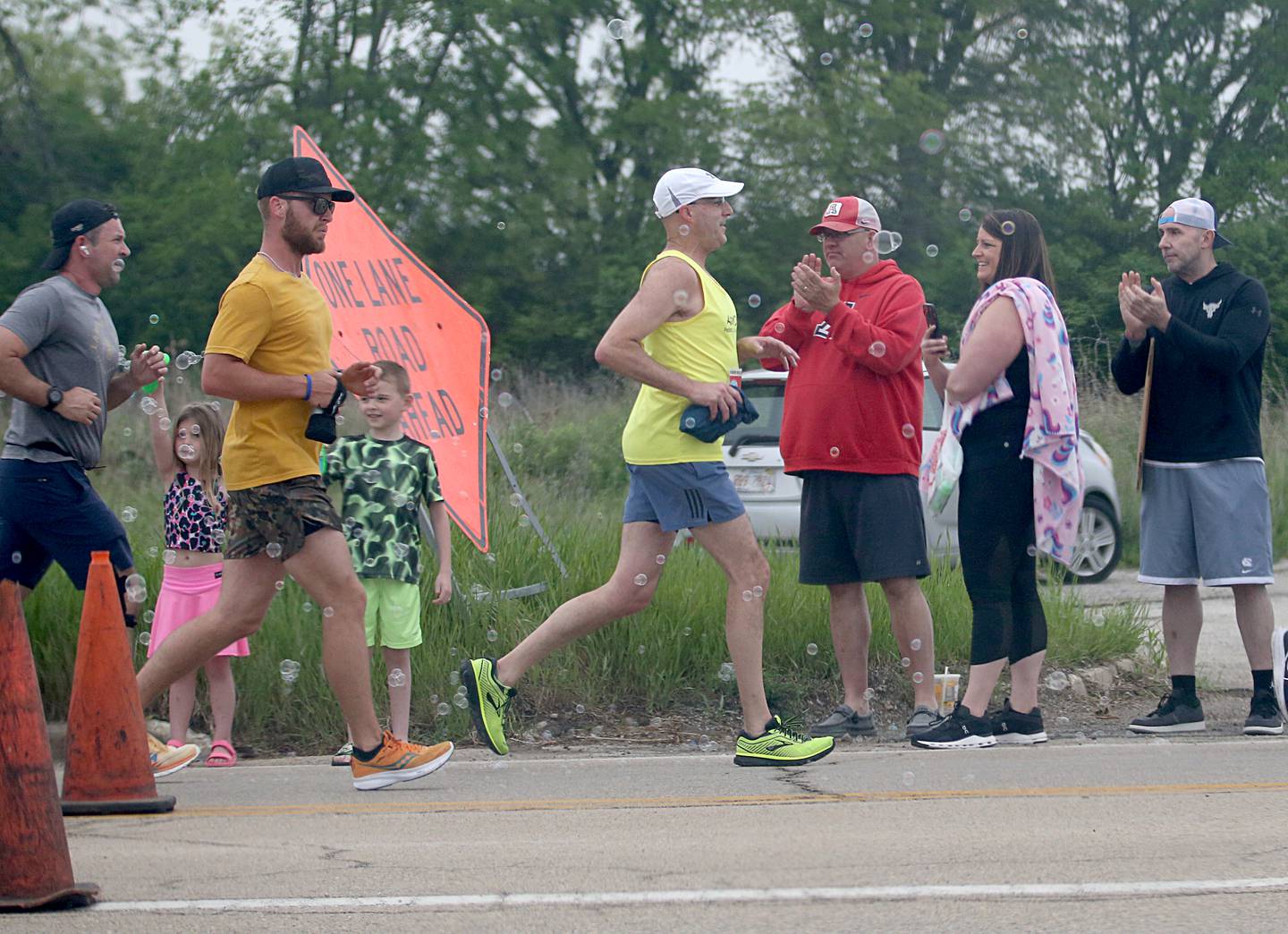 Supporters cheer on runners during the Starved Rock Marathon and Half Marathon on Saturday, May 13, 2023 at the intersection of Illinois Route 178 and Illinois Route 71 near Utica.