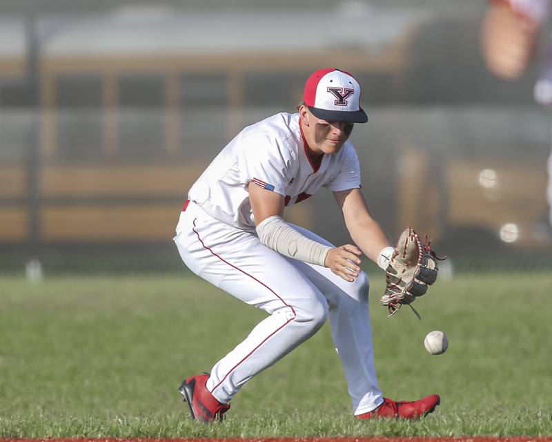Yorkville's Justin Giese (8) fields a bouncer in the at second that ended the game versus Oswego East.  Monday, May 12, 2025 in Yorkville.