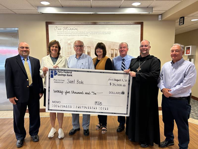 St. Bede alumni attending the presentation at the bank joined by Eve Postula, Superintendent and Abbot Michael Calhoun, OSB, were bank staff members Rob Ankiewicz and Kathy Burris and bank board members Dr. Michael Rooney, Atty. Jonathan Brandt and James Brady.
