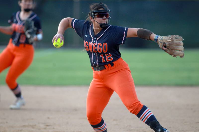 Oswego’s Aubriella Garza throws to firlst during a Class 4A Benedictine Supersectional against Marist on Monday, June 9, 2025 in Lisle.