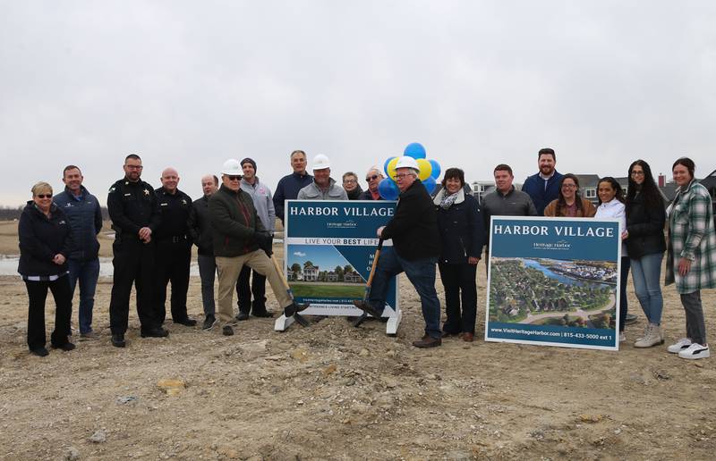 Tom Heimsoth, developer for Heritage Harbor, and Ottawa Mayor Dan Aussem among other Ottawa dignitaries hold a groundbreaking ceremony of the new Harbor Village neighborhood on Thursday, March 9, 2023 at Heritage Harbor in Ottawa. The neighborhood will begin building three of the six low-maintenance homes and expect them to be a big draw for the active adult community.