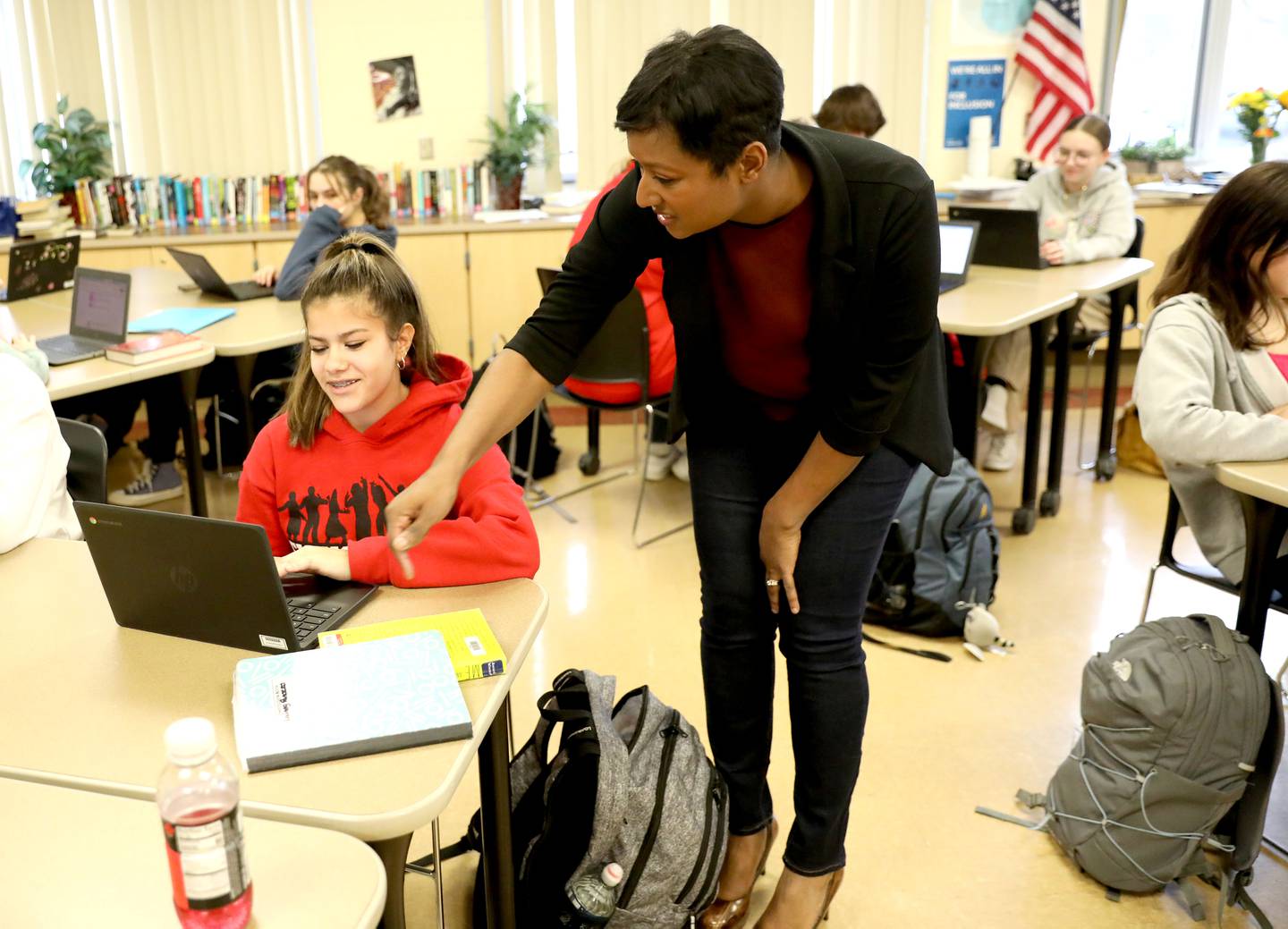 Amber Jirsa, a nominee for Illinois Teacher of the Year, helps student Elaine Panozzo during an English class at Batavia High School.