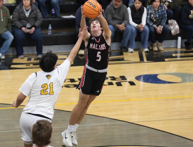 Henry-Senachwine's Jacob Miller catches a pass over Putnam County's Juan Ramirez on Friday, Dec. 5, 2025 at Putnam County High School.