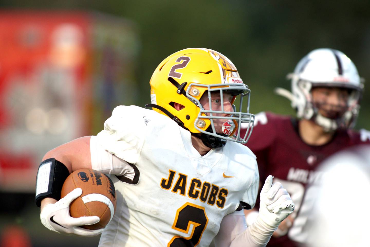 Jacobs’  Caden DuMelle runs the ball against Prairie Ridge in varsity football at Crystal Lake Friday night.