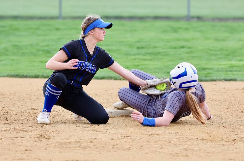 Newman short stop Lucy Oetting puts the tag on a Princeton runner at second Tuesday at Little Siberia Field.