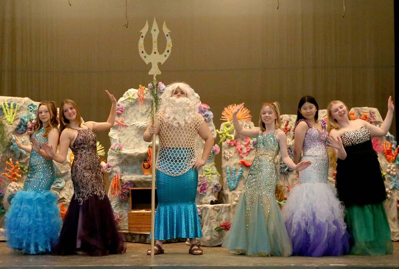 Mersisters Atina played by Lacey Griggs, Aquata played by Chipper Rossi, King Triton (center) played by Gavin Hahn, Allana, played by Lucy Maus, Adrina played by Cindy Wu, and Arista played by Allison Rimmele