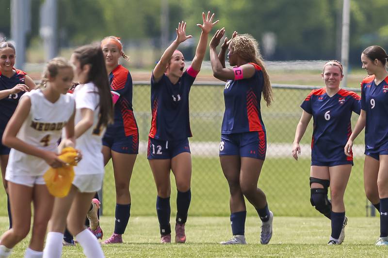 Oswego's Jordyn Washington (18) celebrates her second goal with teammates during Class 3A regional final soccer match between Neuqua Valley at Oswego on Saturday, May 23, 2026 in Oswego.