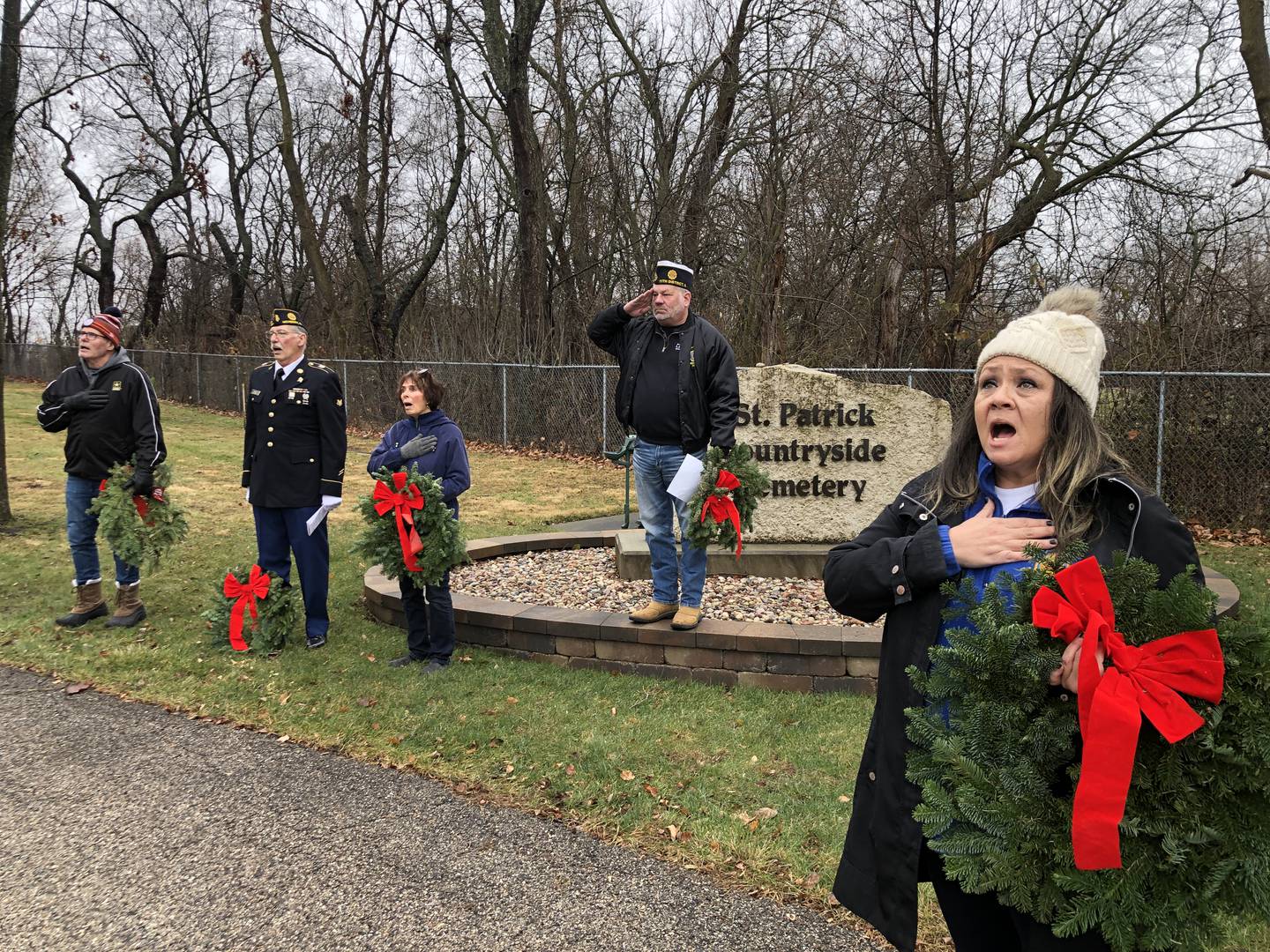 The McHenry American Legion Post 491 laid 288 wreaths at two McHenry cemeteries on Sunday, Dec. 15, 2024. Speaking, and offering prayers, before the wreaths were laid are, from left, McHenry Sons of the American Legion chaplain Richard Clements, McHenry American Legion chaplain Carl Kamienski, and McHenry American Legion Auxiliary chaplain Sharon Nye, Post Commander Chad Miller and Legion Auxiliary Vice President Susan Yon Hanson.