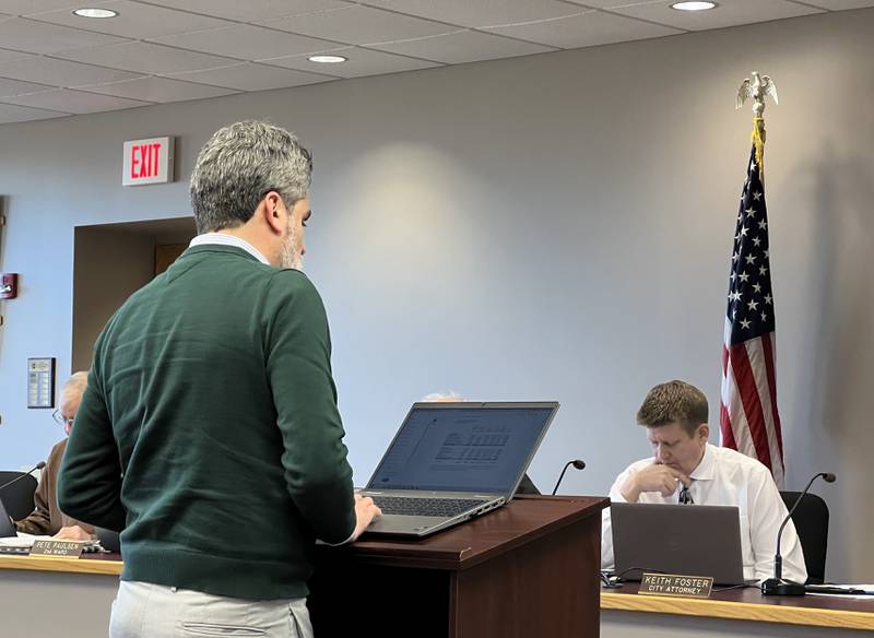Sycamore Finance Director Kristian Dominguez talks with City Manager Michael Hall during the March 18, 2024, Sycamore City Council meeting.