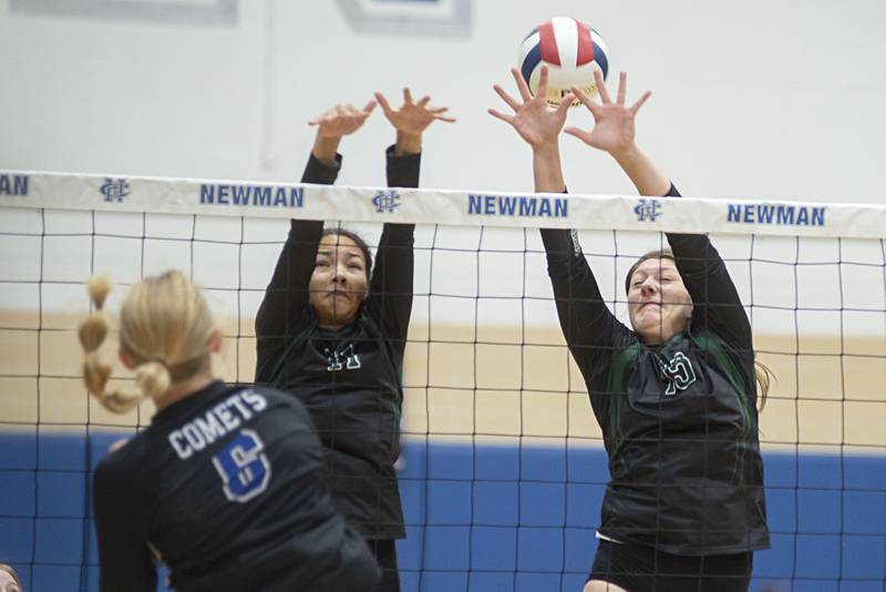St. Bede’s Amanda Wojcik (left) and Isabella Pinter go up to block a shot against Newman Tuesday, Sept. 27, 2022.