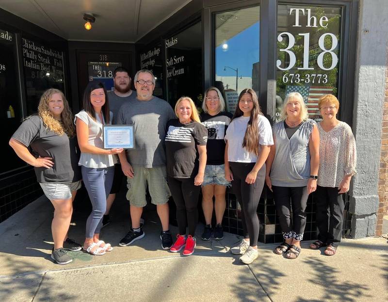 (Left to right) Megan Wright (member services coordinator for the chamber), Courtney Levy (executive director at the chamber), Brandon Loudenback (318), Joe Cameron (owner), Cindy Cameron (owner and chamber ambassador), Tammy Geiss (318), Liz Aldana (318), Karen Karpati (board) and Gigi Lansford (chamber ambassador) pose as the 318 is honored as the Streator Chamber's business of the month for August 2022.