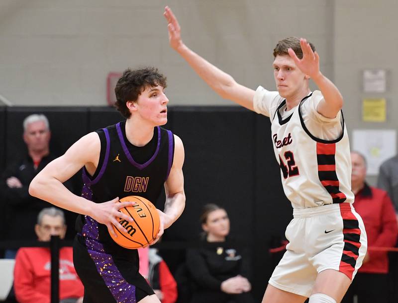 Downers Grove North’s Colin Doyle looks to pass as Benet’s Colin Stack (right) defends during the Class 4A Benet Sectional championship game on March 7, 2025 at Benet Academy in Lisle.