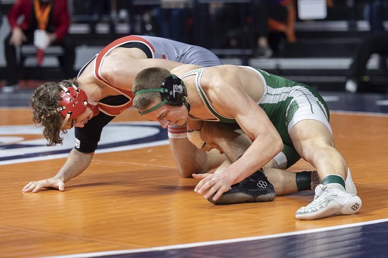Coal City’s Aidan Kenney works on the leg of Vandalia’s Dillon Hinton in the 1A 157 pound class Saturday, Feb. 21, 2026, at the IHSA wrestling finals in Champaign.