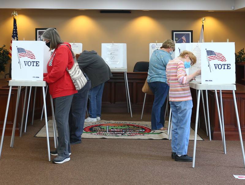 Voters fill voting booths at the Utica Village Hall on Tuesday April 6, 2021. As of 9:45a.m. Utica had over 175 voters.