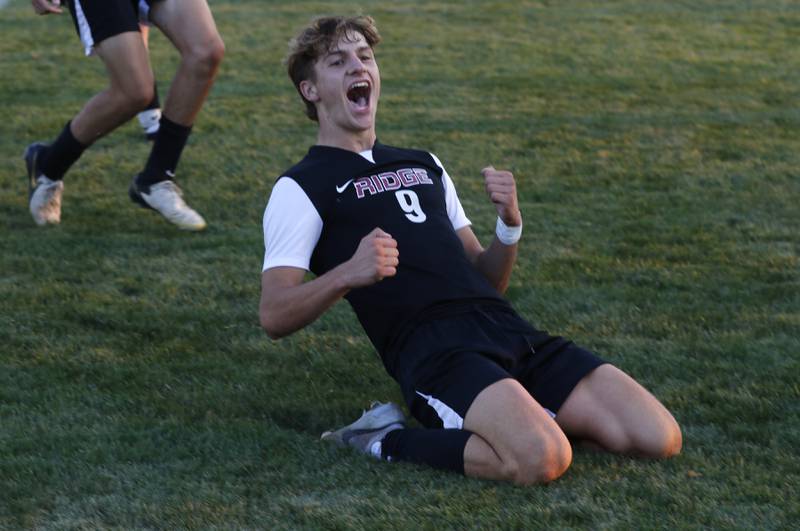 Prairie Ridge's Henry Knoll celebrates  his goal during a Fox Valley Conference soccer match against Crystal Lake Central on Thursday, Oct. 10, 2024, at Prairie Ridge High School.