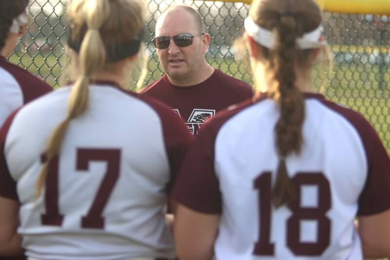 Marengo’s head coach Dwain Nance speaks to his players after a win over Richmond-Burton in varsity softball at Marengo Tuesday.