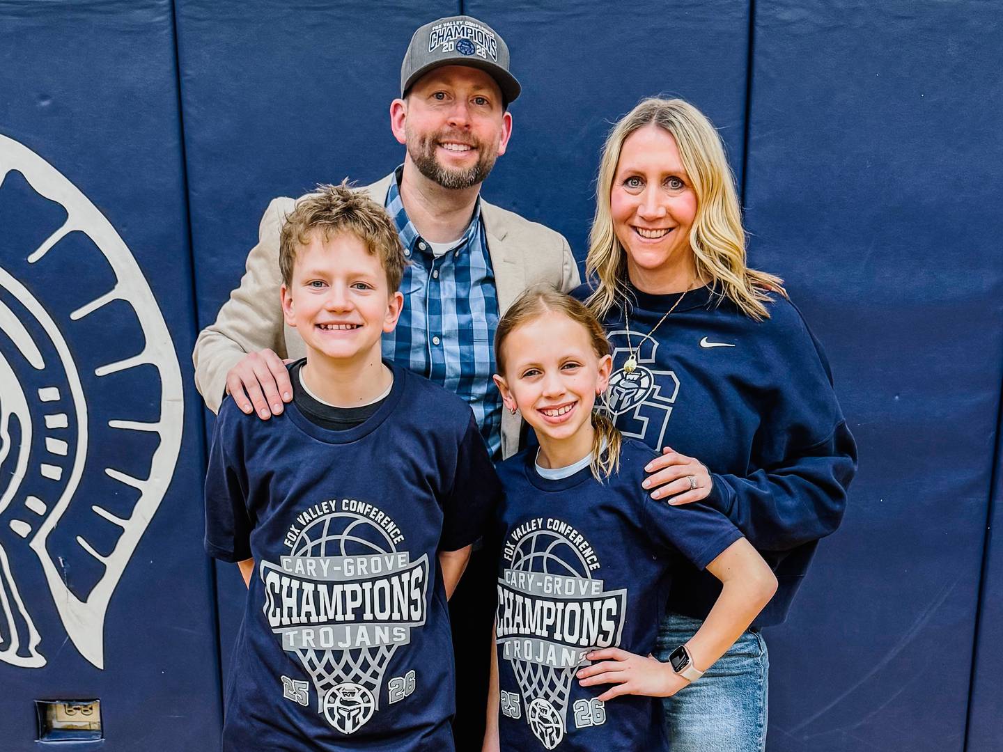 Cary-Grove boys basketball coach Adam McCloud is seen with his wife, Alexis, and children Connor and Abby.