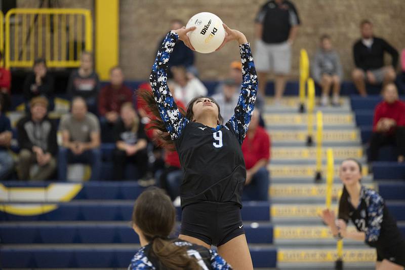 St. Francis’ KK Dumpit sets the ball Friday, Nov. 4, 2022 during the Spartan’s 3A supersectional game against Metamora.