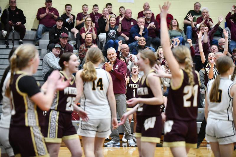 Watseka head coach Barry Bauer, center, applauds his team as the Warriors secured a 50-24 victory over Reed-Custer in the IHSA Class 2A Herscher Sectional semifinal on Tuesday, Feb. 25.