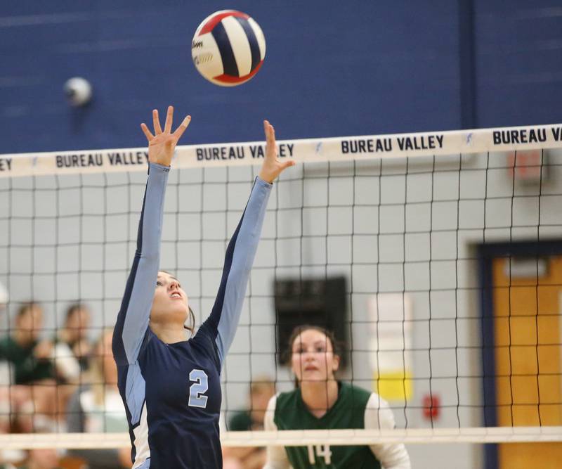 Bureau Valley's Matalyn Michlig sets the ball in play as St. Bede's Aubree Acuncius watches from the other side of the net on Tuesday, Sept. 5, 2023 at Bureau Valley High School.