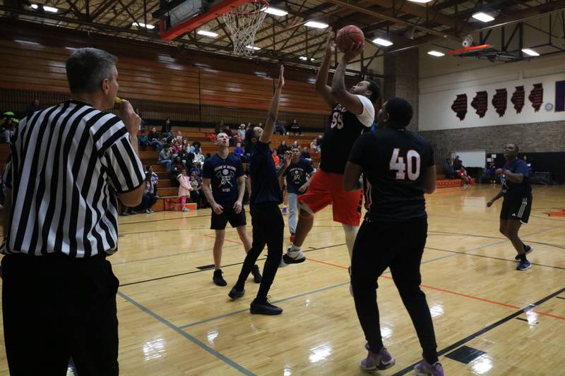 Luke Davis shoots his shot Monday, Dec. 2, 2024, at the annual charity basketball game held at Huntley Middle School in DeKalb.