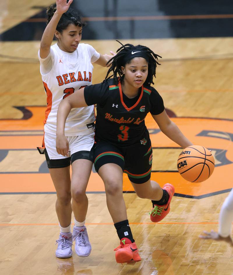 Plainfield East's Gianna Thompson pushes the ball ahead of DeKalb's Nazeria Dean Thursday, Feb. 12, 2026, during their game at DeKalb High School.