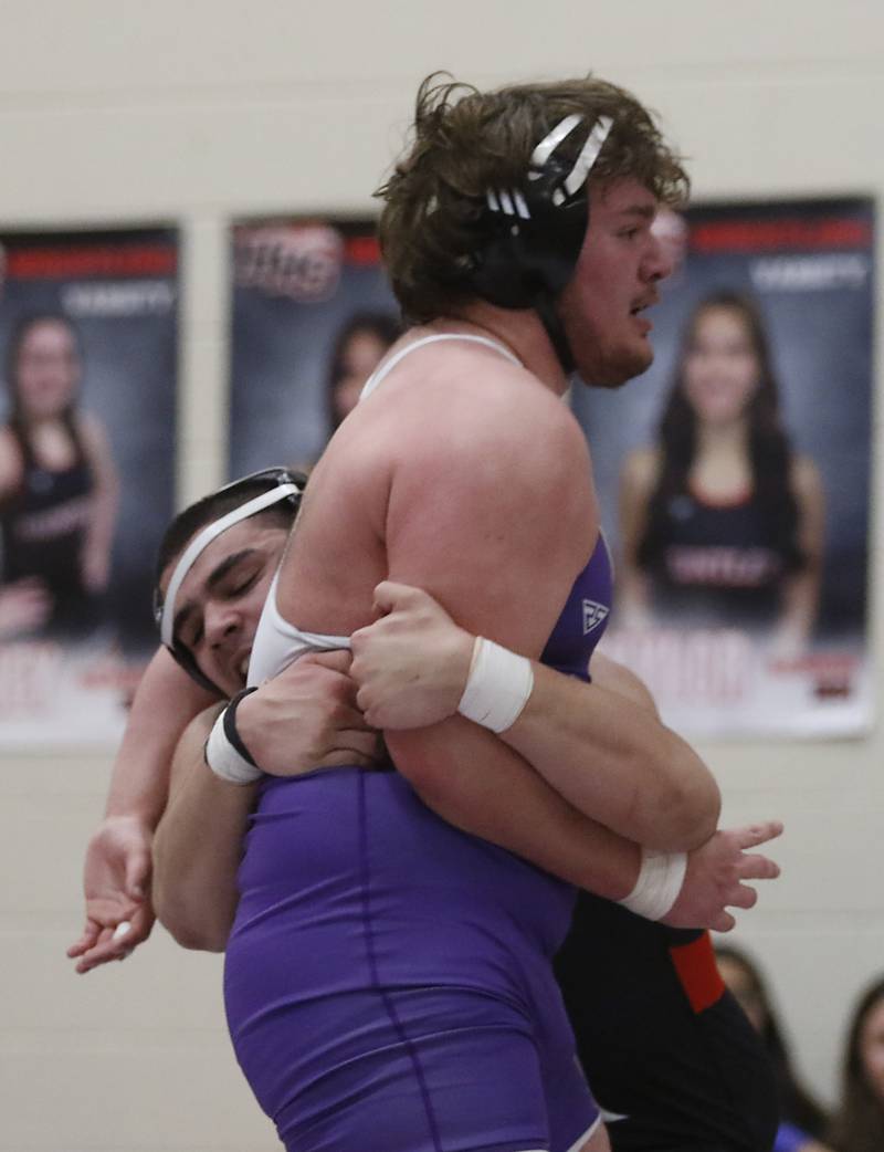 Huntley’s Markos Mihalopolus takes down Hampshire's Joseph Ochoa during the 285-pound match of a Fox Valley Conference wrestling match Wednesday, Jan. 24, 2024, at Huntley High School.