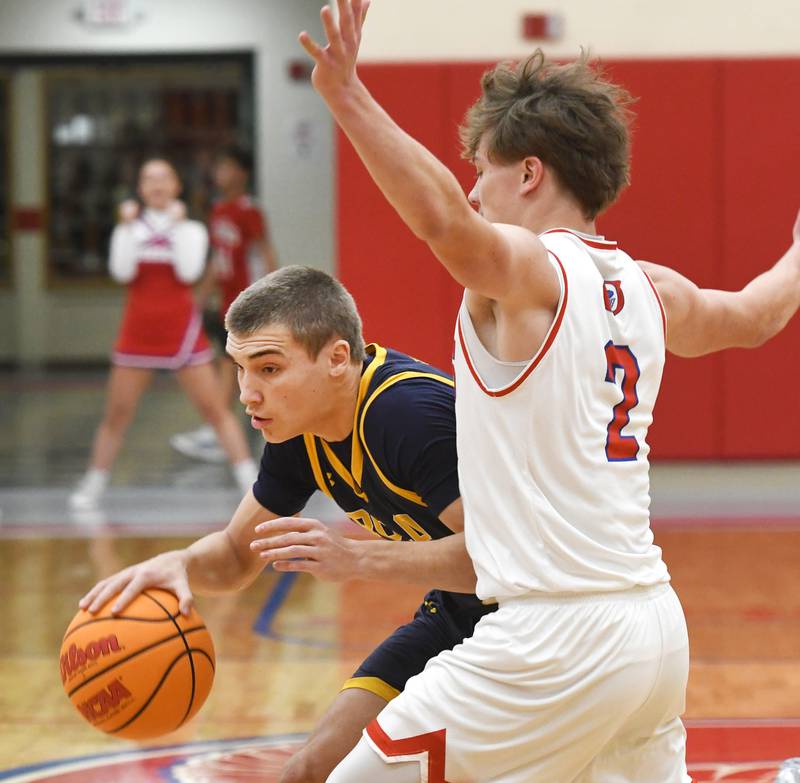 Polo's Mercer Mumford drives the lane as Oregon's Cooper Johnson defends on Friday, Dec. 5, 2025 at the Blackhawk Center in Oregon.