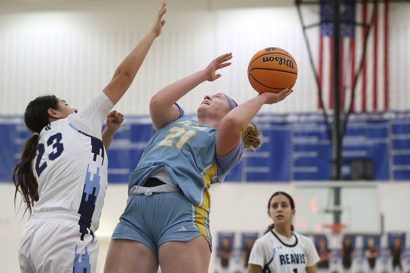 Joliet Catholic’s Emma Birsa puts up a contested shot against Reavis in the Peotone Blue Devils Holiday Classic championship game on Monday, Dec. 29, 2025 in Peotone.