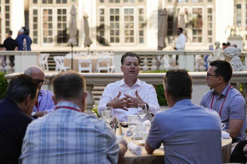 Chicago Bears head coach Matt Eberflus, center, speaks with reporters during the NFL's owners meeting, Tuesday, March 29, 2022  in Palm Beach, Fla.