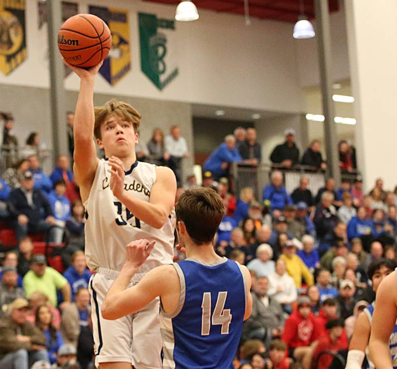 Marquette's Peter McGrath (left) shoots a jump shot over Princeton Grady Thompson during the Colmone Classic tournament on Friday, Dec. 9, 2022 at Hall High School in Spring Valley.