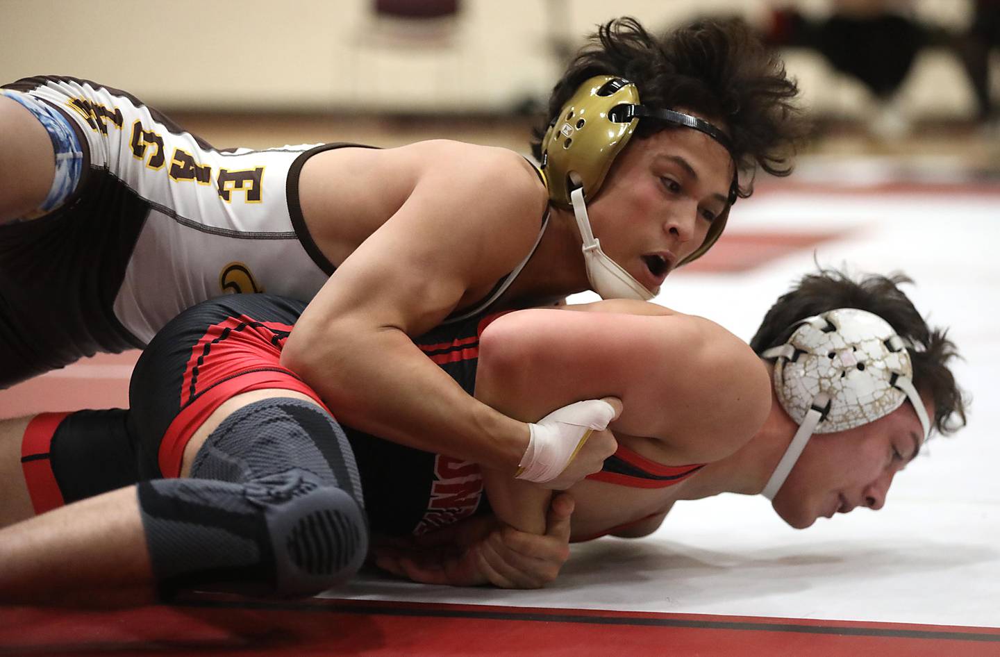 Jacobs’ Ben Arbotante controls Huntley’s Colin Abordo during the 126—pound match of a Fox Valley Conference wrestling meet on Thursday, Dec. 11, 2025, at Huntley High School.