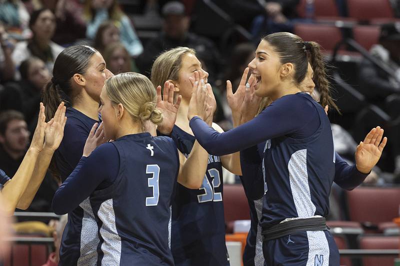 Nazareth Academy celebrates their win over Waubonsie Valley Friday, March 1, 2024 in the girls basketball 4A state semifinal at CEFCU Arena in Normal.