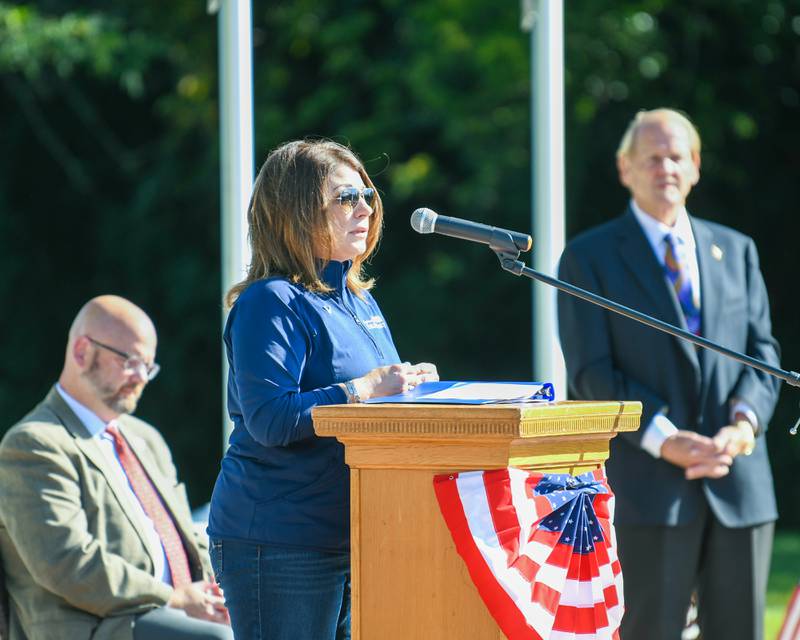 Cortney Strohacker, executive director of the DeKalb County Convention and Visitors' Bureau, speaks during a dedication ceremony for the completion of phase one of the DeKalb Elks Veteran’s Memorial Plaza in DeKalb Saturday, Oct. 1, 2022.