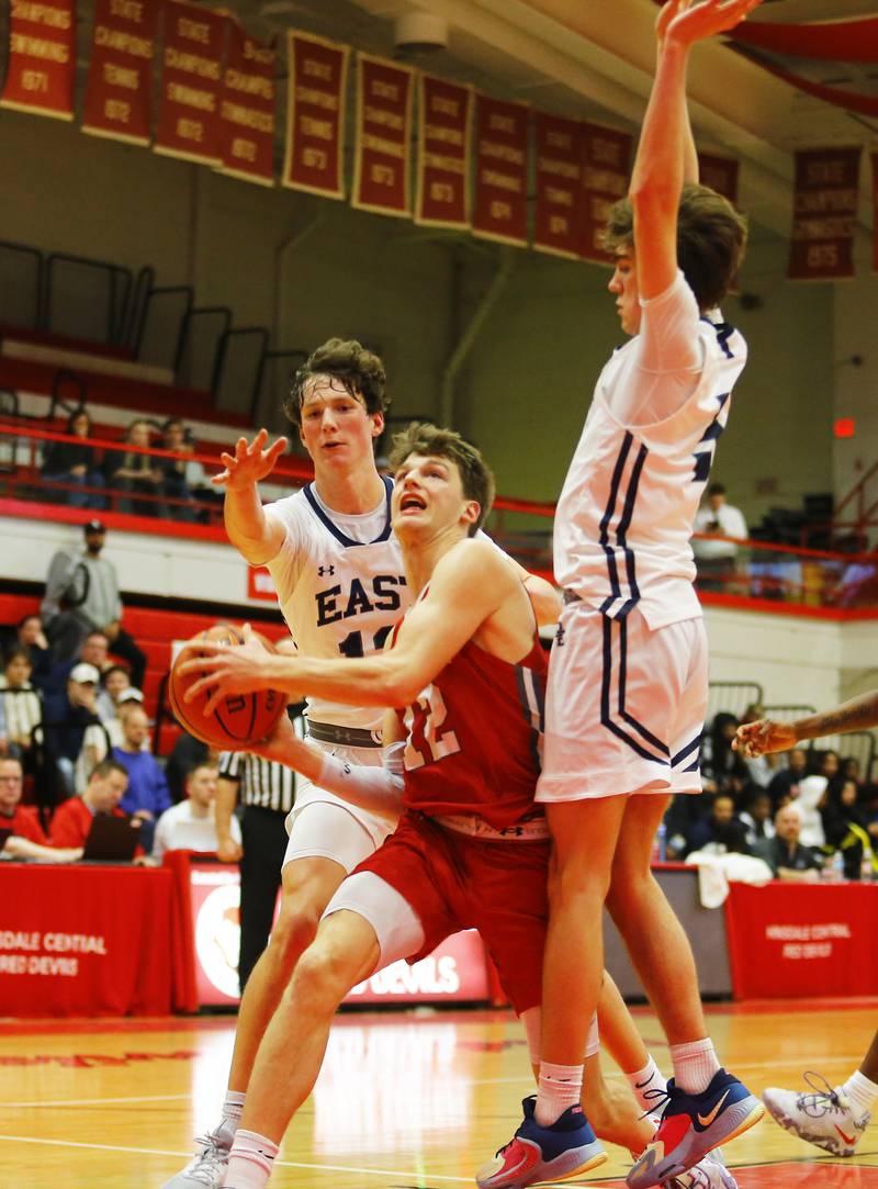Hinsdale Central's Daniel Orozco (22) drives to the basket during the Hinsdale Central Holiday Classic championship game between Oswego East and Hinsdale Central high schools on Thursday, Dec. 29, 2022 in Hinsdale, IL.
