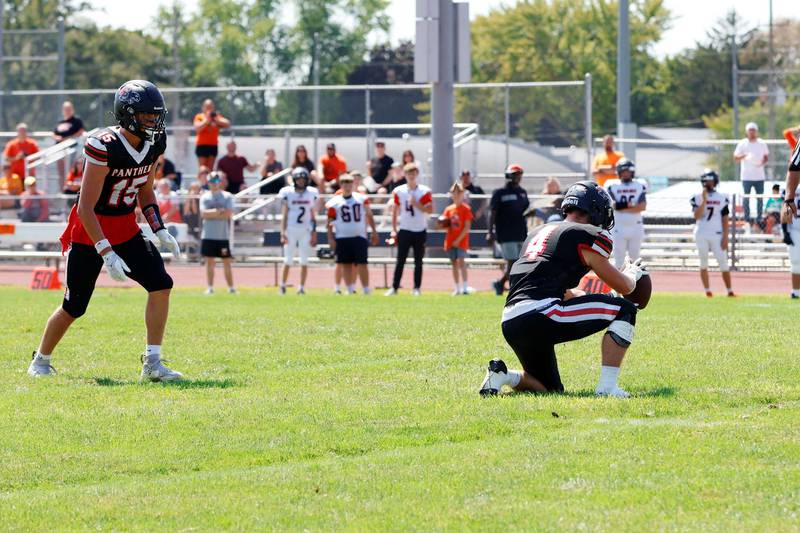 Erie-Prophetstown Panthers #4 Max Milem holds the ball for #15 Evan Steimle as he kicked the first points of the game against the visiting Kewanee Boilermakers for their season opener in Prophetstown on Saturday, Aug 30, 2025.. The Panthers ended the game on top 29-6.