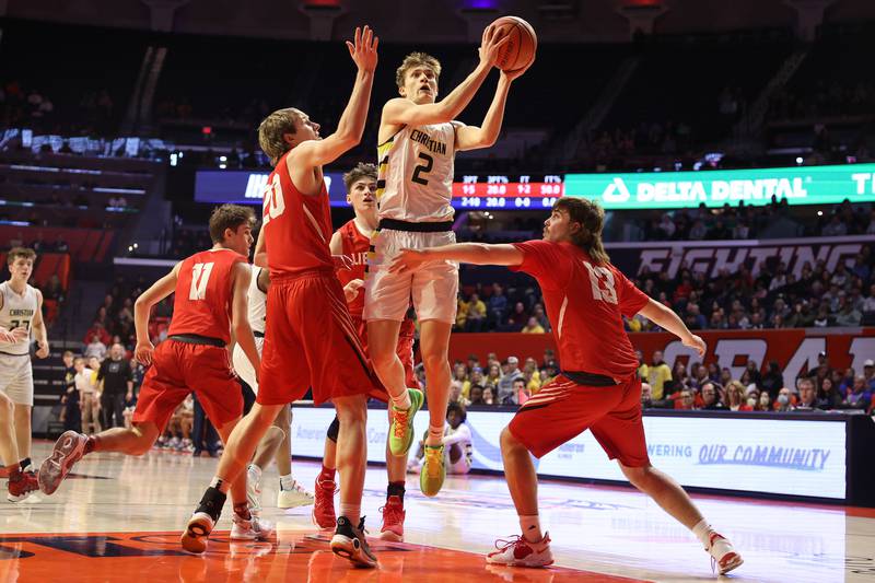 Yorkville Christian’s Jaden Schutt splits the defense for a basket against Liberty in the Class 1A championship game at State Farm Center in Champaign. Friday, Mar. 11, 2022, in Champaign.