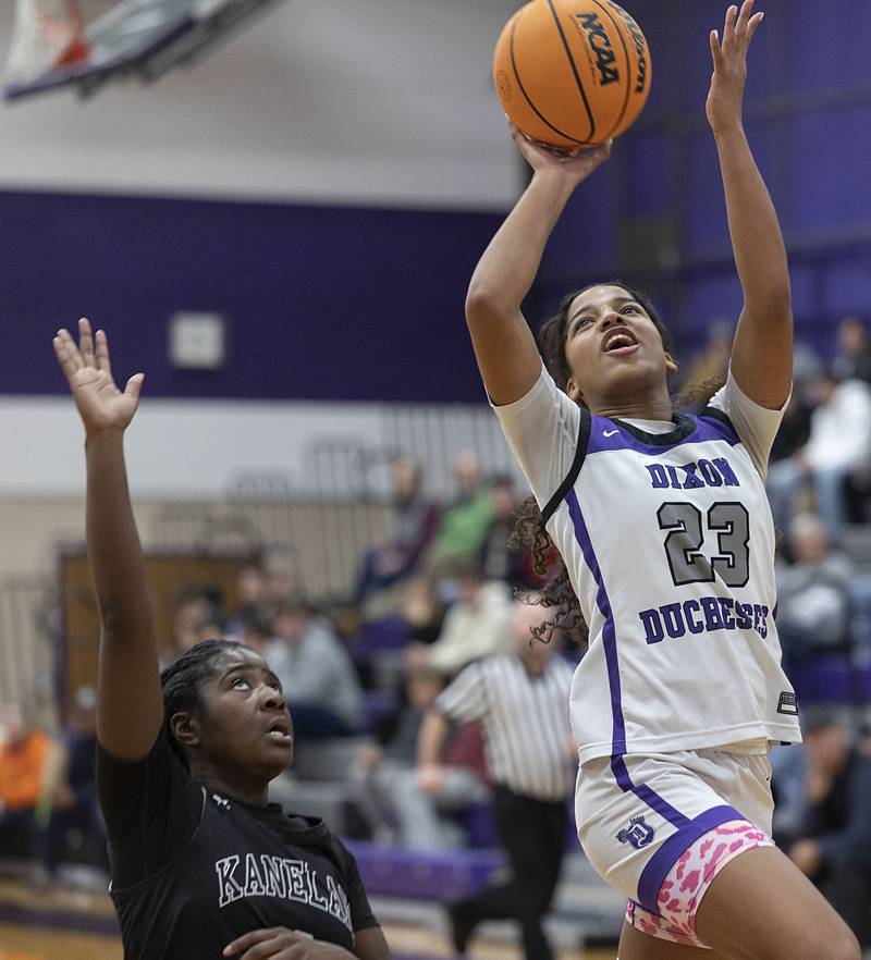 Dixon’s Presley Lappin looks to put up a shot against Kaneland’s Daniela Ridolfi (left) and Lillyana Crawford Wednesday, Dec. 10, 2025.