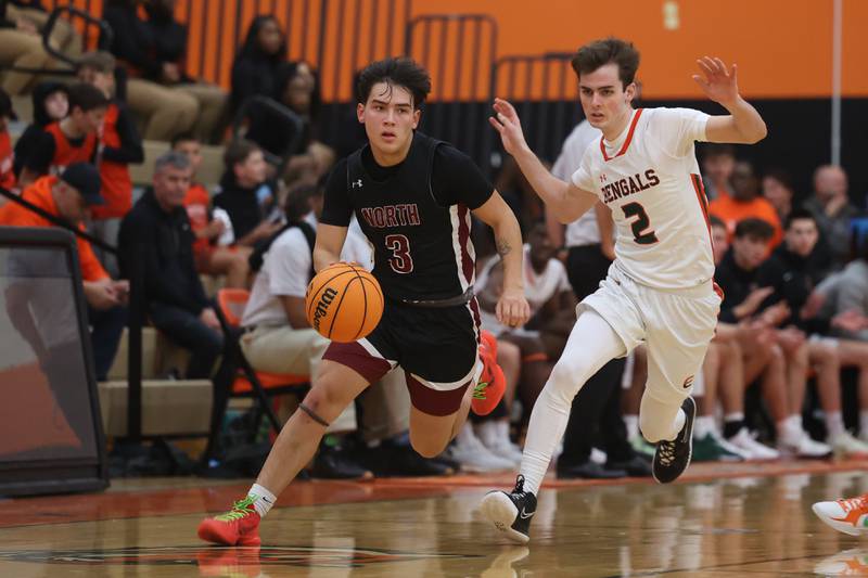 Plainfield North’s Lukas Alvarez works the ball upcourt against Plainfield East on Tuesday, Jan 14, 2025.