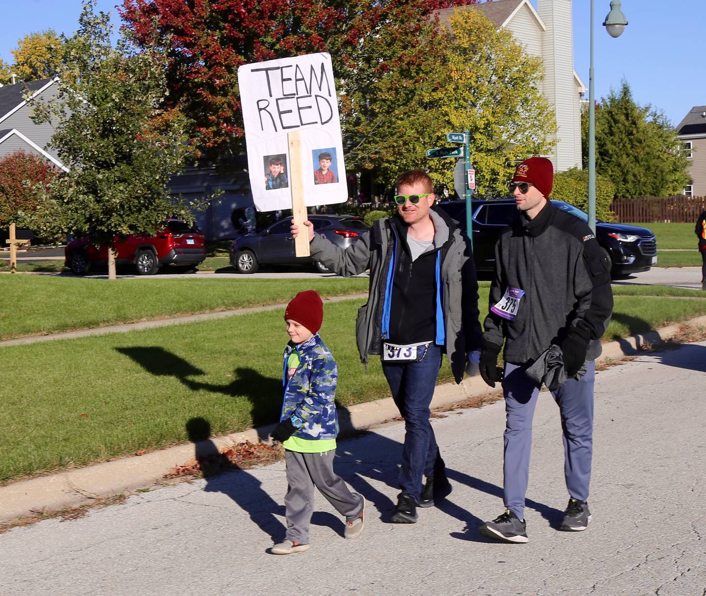 (Left to right) Mac Meersman, Peter Meersman and John Ferrara participate in the Marklund 11th Annual Run, Walk & Roll 5K/1 Mile on Sunday, Oct. 15, 2023 in Geneva.