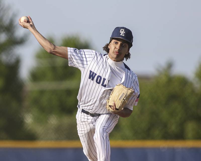 Oswego East's Carter Davis (13) delivers a pitch during baseball game between Oswego East at Oswego. Monday, May 19, 2025 in Oswego.