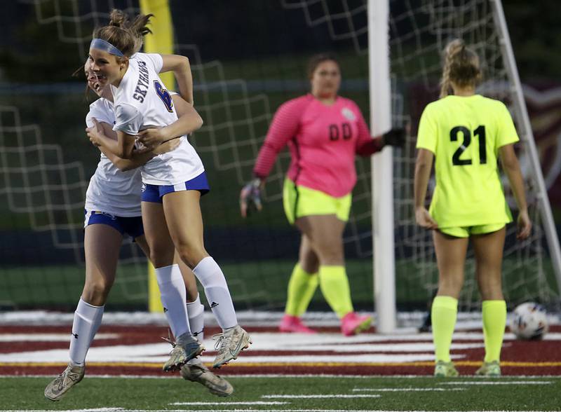 Johnsburg's Elizabeth Smith (right) is hugged by her teammate Johnsburg's Lauren McQuiston after Smith scored a goal during Kishwaukee River Conference Girls Soccer  Tournament Championship Match against Richmond-Burton Wednesday, May 3, 2023, at Richmond-Burton High School.