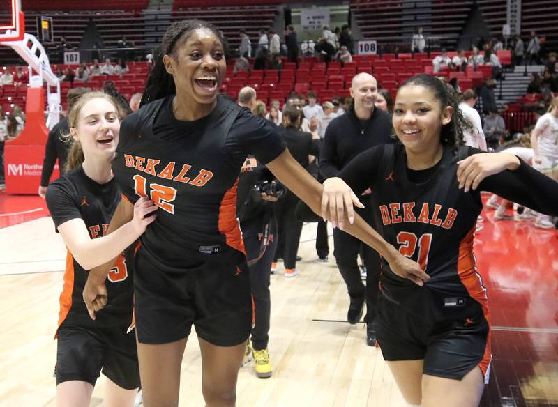 DeKalb players celebrate after their win over Sycamore Friday, Jan. 31, 2025, in the FNBO Challenge in the Convocation Center at Northern Illinois University in DeKalb.