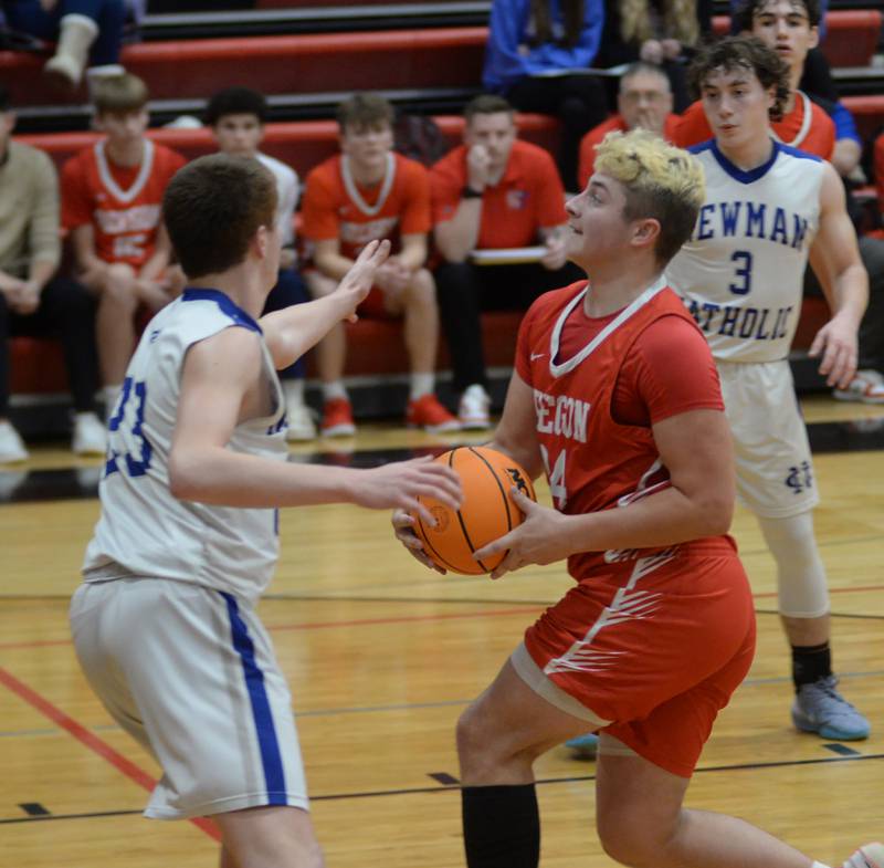 Oregon's Kade Girton (34) drives to the basket against Sterling Newman on Wednesday, Dec. 18, 2024 at the 63rd Annual Forreston Holiday Tournament.