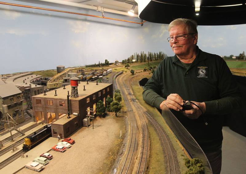 Norm Kocol, of Johnsburg watches his Road Switcher -3  locomotive move on the tracks at the Lake County Model Railroad Club in Wauconda. The club is celebrating their 50th anniversary.