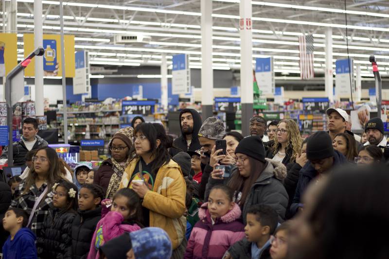 Families listen to a speech from Joliet Police Chief William Evans during the 36th annual Santa's Cops event on Saturday, Dec. 6, 2025, at Walmart, 401 Illinois Route 59, in  Shorewood.
