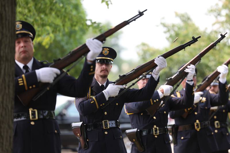 Joliet Police Honor Guard does a 21-gun salute at a special Flag Day ceremony dedicating a memorial to remember the 28 World War II Submarines that traveled through Joliet on their way to the Pacific theater in Bicentennial Park on Wednesday, June 14, 2023 in Joliet.